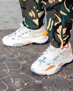 The AAPE Dimension is a retro style runner that features a multi-paneled upper w...