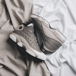 The “Atmosphere Grey” Air Jordan 13 is helping Jordan Brand usher in spring. Thi...